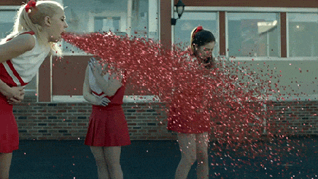 Cheerleader-Throwing-Up-Glitter-Team-Spirit